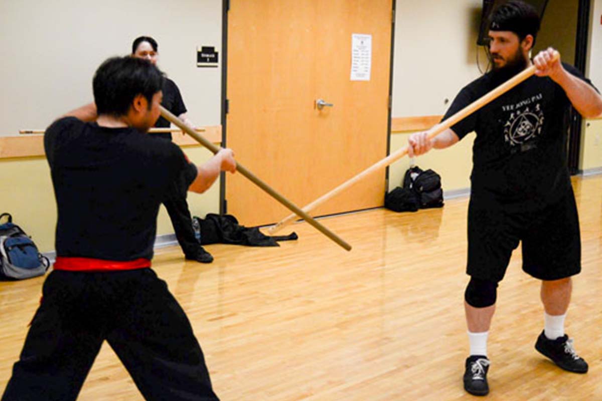 Students practicing weapons