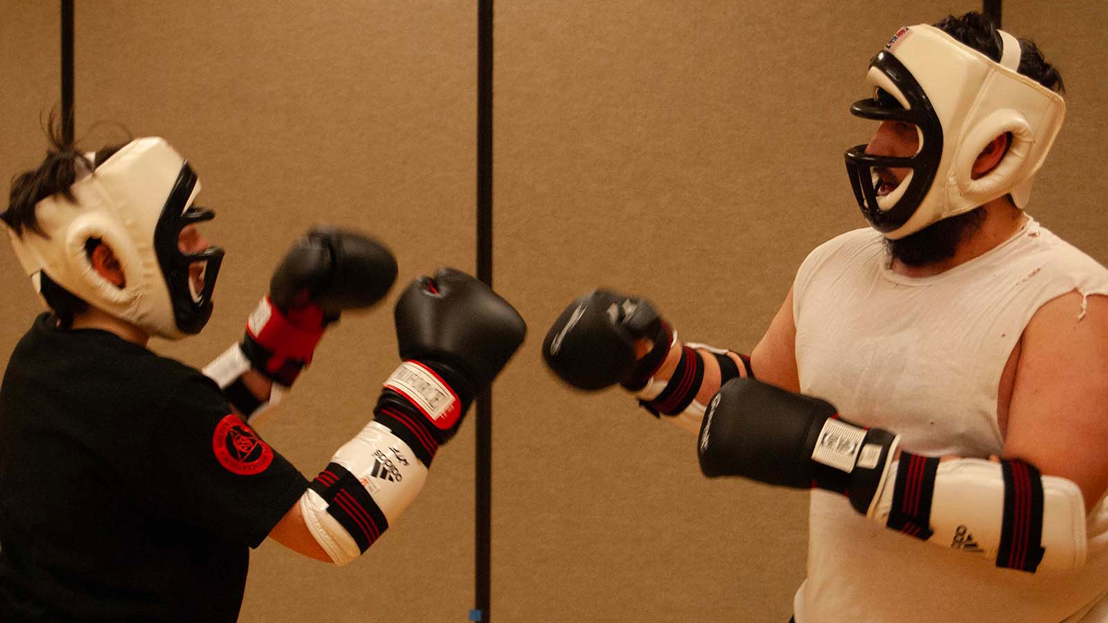 Students sparring with protective gear